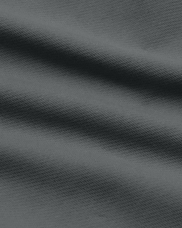 7 Carbon Chino Shorts 2.0 close-up, showing waffle-knit texture.