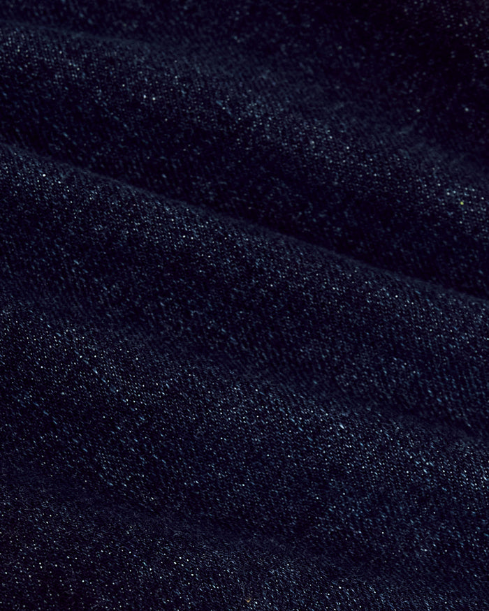 Close-up of Indigo Rinse Straight Authentic Denim Jeans fabric.