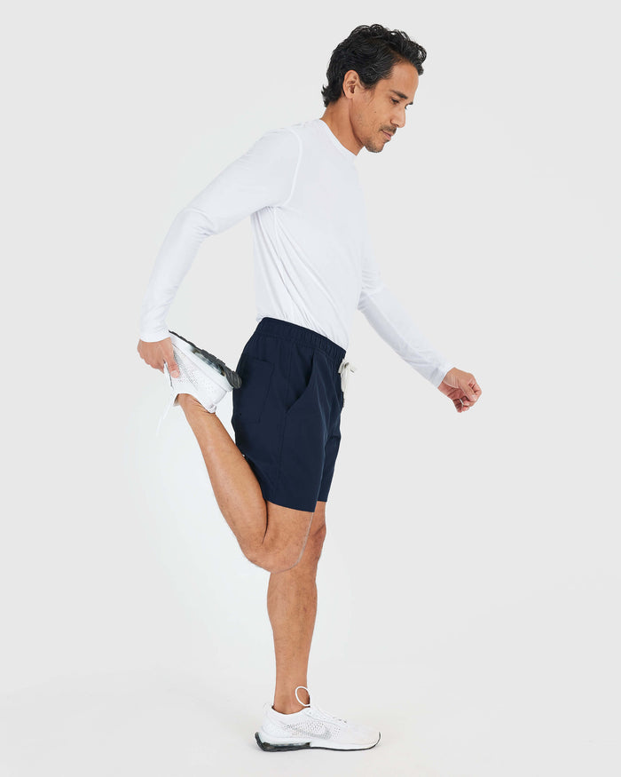 Man stretching in Navy Active Quick Dry Shorts with Liner.