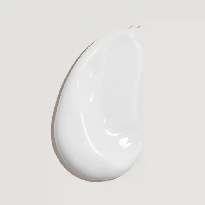 White ceramic teardrop-shaped plate on a light gray background