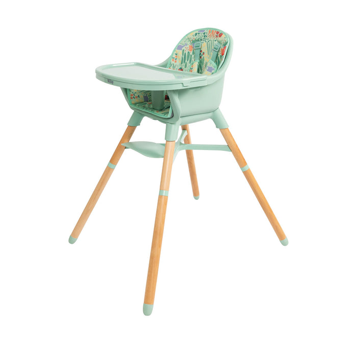The Nuby 4-in-1 Multi-Use High Chair | Green Garden features light wooden legs, a mint green seat and tray, and a colorful cushion—designed to grow with your child through every mealtime stage.