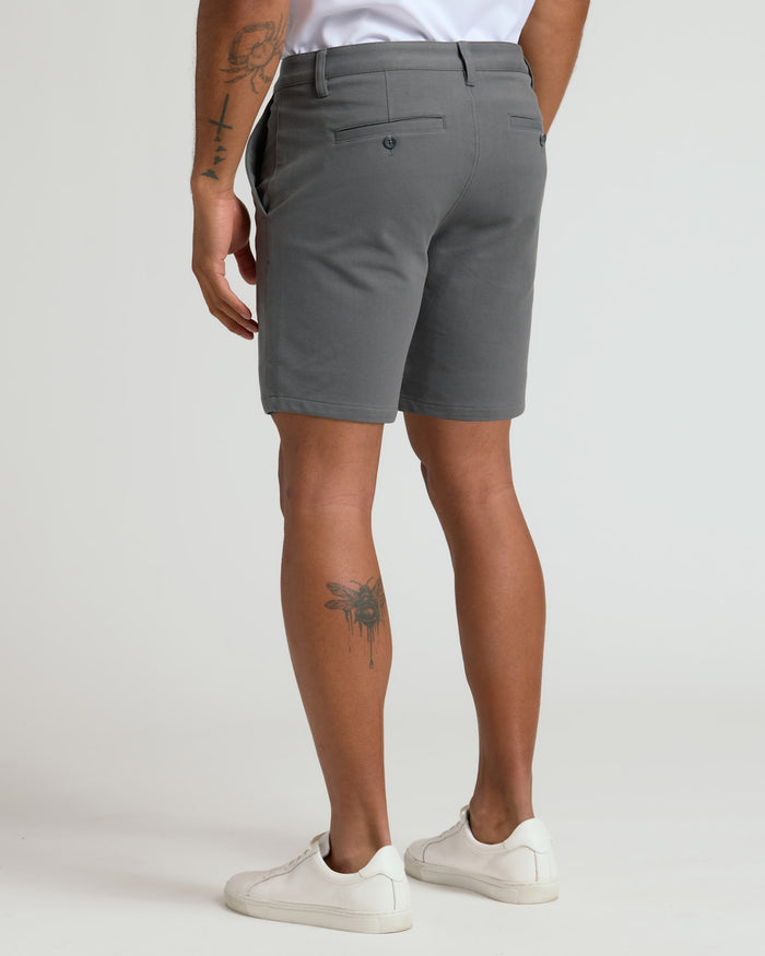 Back view of 7 Carbon Chino Shorts 2.0 worn with sneakers.
