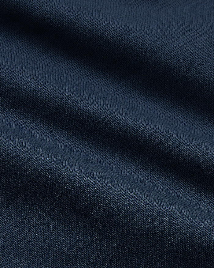 7 Navy Linen Shorts showcasing fine weave and gentle fabric folds.