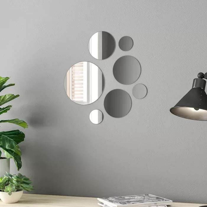 This Mirror features a wide oval frame designed with a Contemporary 3-D wave and finished in a bright silver leaf. Wall Mirror Features Bright silver leaf wavy frame Resin frame A contemporary update to a classic design Reflects light and brightens any room Eyelet hooks mounted on back of mirrors for installation Oval traditional cut glass and etched wall mirror Clean with soap and water One year warranty