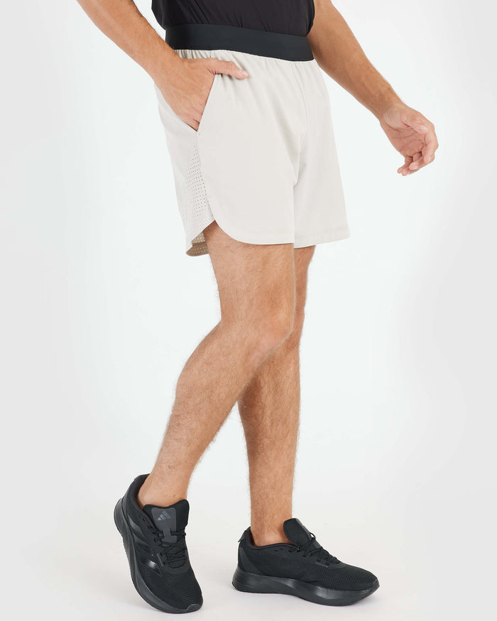 7 Sandstone Active Training Short with side pockets and mesh hem.