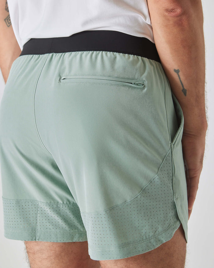 7 Slate Green Active Training Shorts 2.0 with zip pocket and perforated hem.