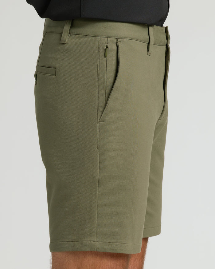 9 Military Green Chino Shorts 2.0, side view, showcasing pockets and belt loops.