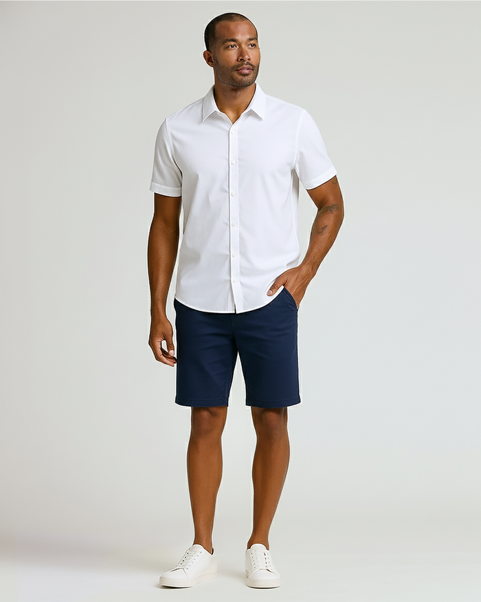 Man wearing 9 Sandstone & Navy Chino Shorts 2-Pack with white shirt.