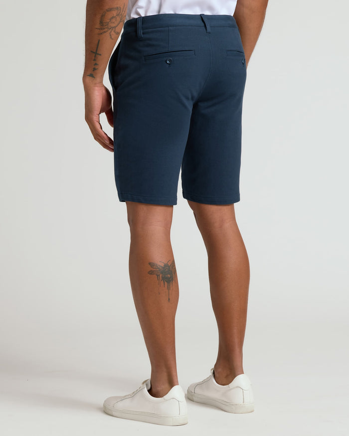 9 Navy Classic Chino Shorts 2.0 worn with white sneakers.