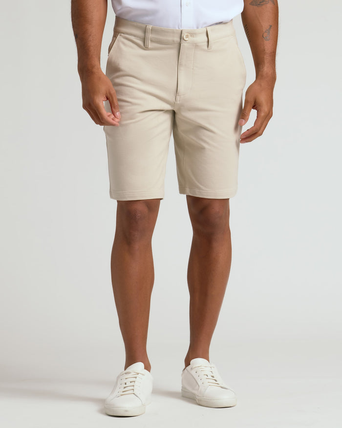 9 Sandstone Chino Shorts 2.0 with white sneakers, casual style.