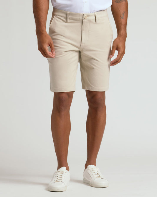 9 Sandstone Chino Shorts 2.0 with white sneakers, casual style.