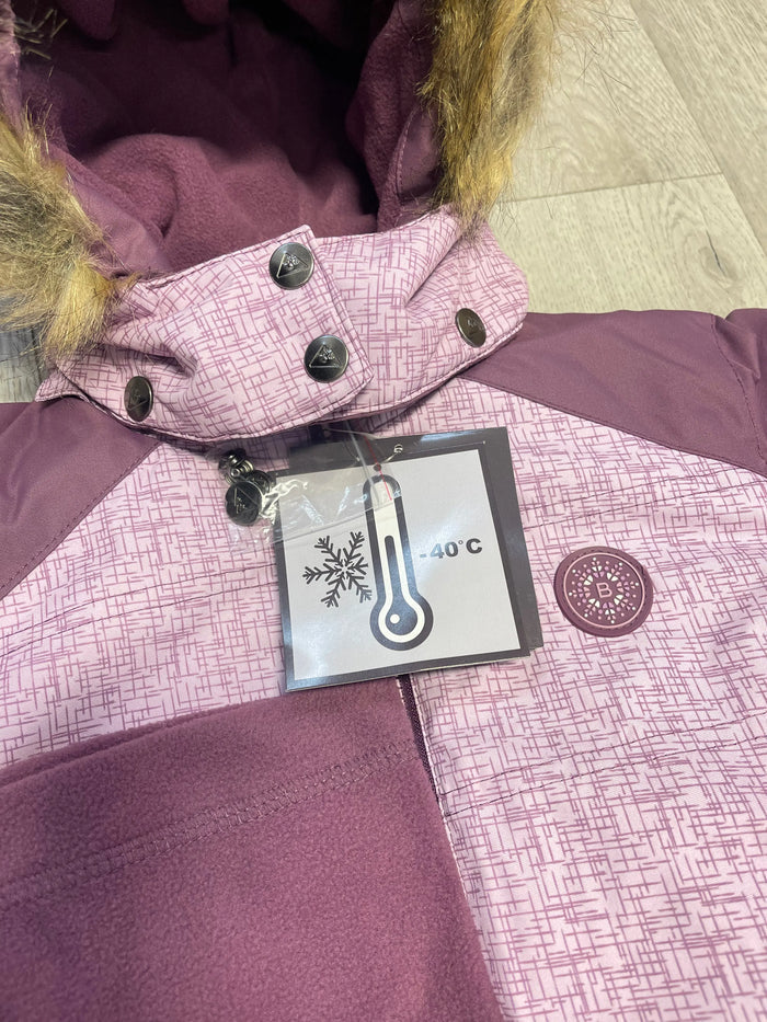 Close-up of Blizz girls Lavender snowsuit showing removable hood, faux fur, label, and jacket details.