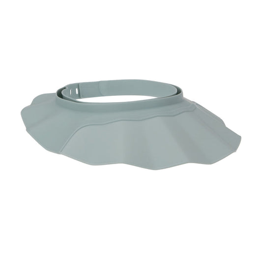 The Baby Bath Hat is a light gray, adjustable hat with ruffles and a strap, designed to protect your baby's face and eyes from water or shampoo for a tear-free bath.