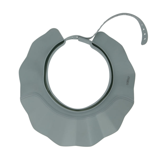 The Baby Bath Hat is a grey, flexible, petal-shaped silicone cap with an adjustable strap and fastening holes. It fits around your baby's head to shield their face and eyes from water for a comfortable, tear-free bath experience.