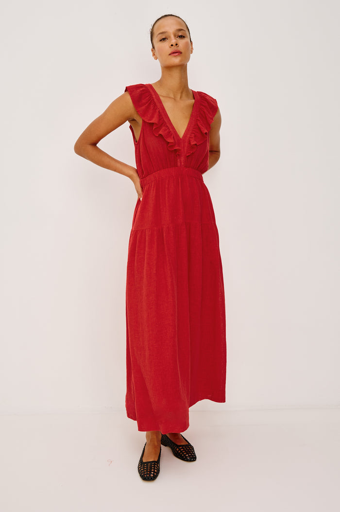 Beaux Maxi Dress in Linen With Ruffle V-Neckline, Elastic Empire Waist, Single-Tiered Lined Skirt, and Side Pockets in Tomato Colorway - Full Body Front View Featured on Model