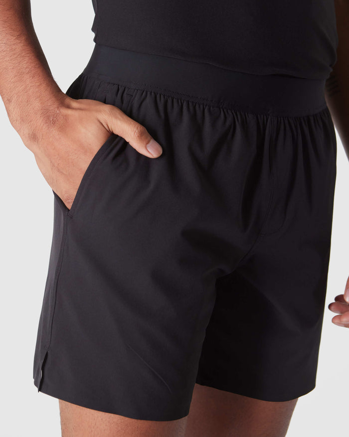 Black 2 In 1 Training Short with elastic waistband and side pockets.