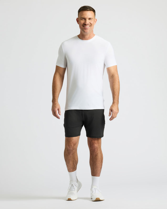 Man wearing Black Active Comfort Shorts with a white T-shirt.