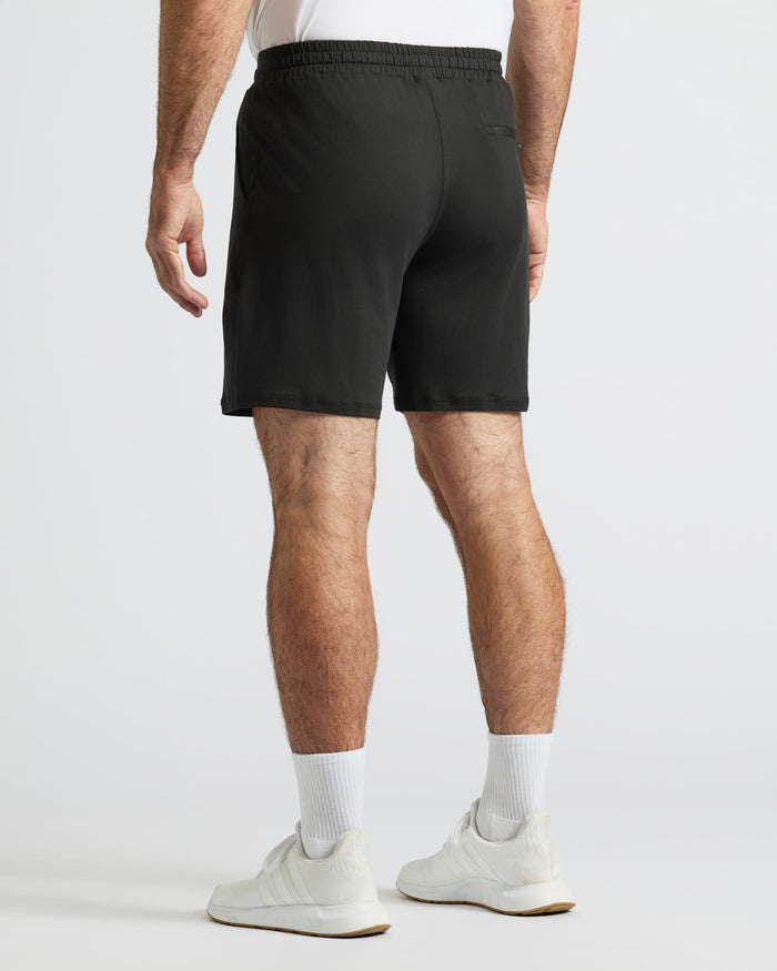 Wearing Black Active Comfort Shorts with white socks and sneakers.