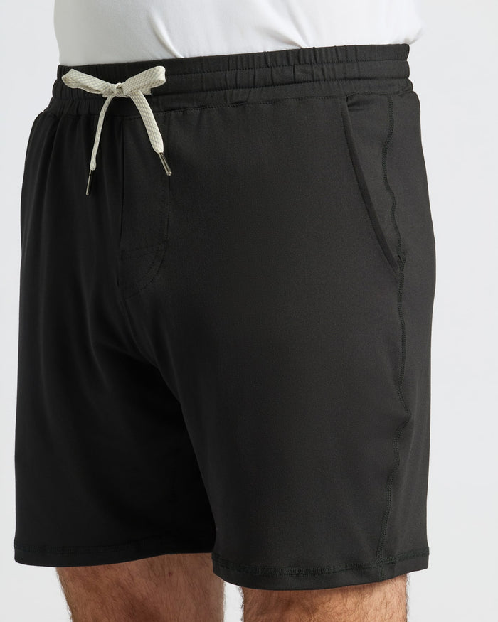 Black Active Comfort Shorts with drawstring, pockets, visible topstitching.