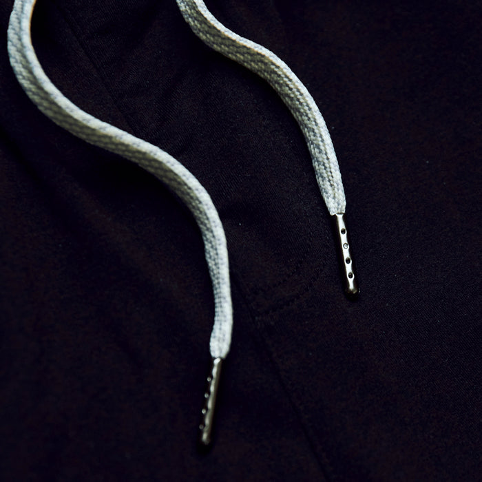 Black Active Joggers' braided drawcords with metal aglets on fabric.