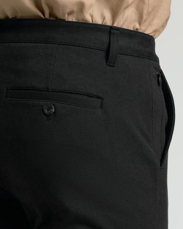 Black Slim Chino Pants 2.0 waistband, belt loop, back pocket, side seam.