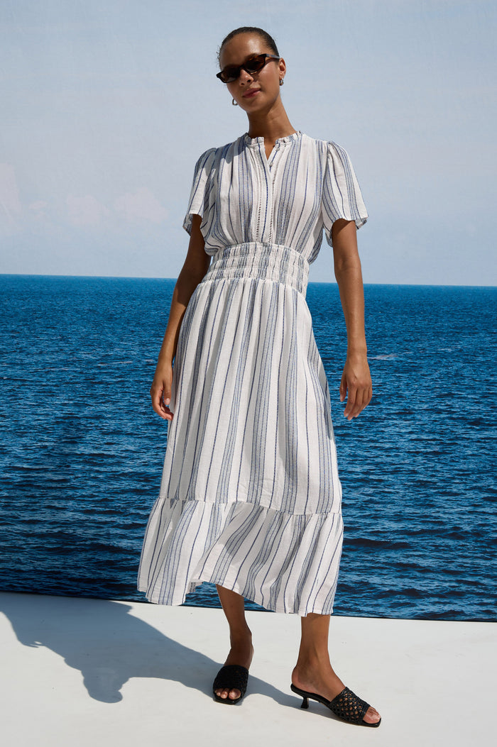 Brent Maxi Dress in Luxe Linen With Front Half Placket, Ladder and Ruffle Trim, Short Wide Sleeves, Smocked Waist, Single-Tier Hem in Salino Stripe Colorway - Full Body Front View Featured on Model