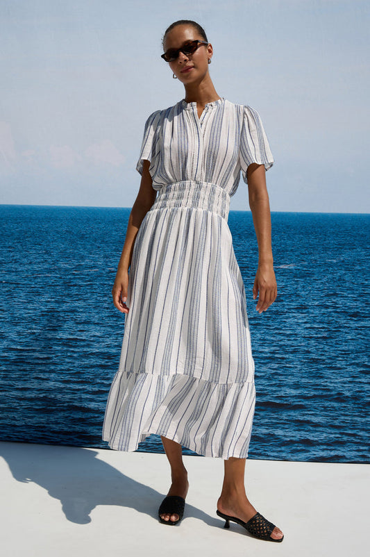 Brent Maxi Dress in Luxe Linen With Front Half Placket, Ladder and Ruffle Trim, Short Wide Sleeves, Smocked Waist, Single-Tier Hem in Salino Stripe Colorway - Full Body Front View Featured on Model