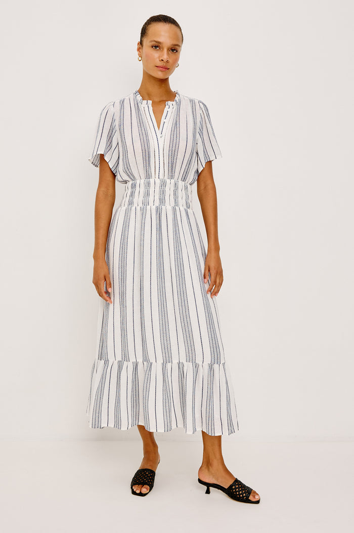 Brent Maxi Dress in Luxe Linen With Front Half Placket, Ladder and Ruffle Trim, Short Wide Sleeves, Smocked Waist, Single-Tier Hem in Salino Stripe Colorway - Full Body Front View Featured on Model
