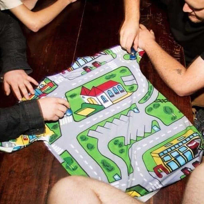 Car Carpet City T-Shirt - The distinct "pavement gray" (#9E9E9E) two-lane road network contrasting against flat "parkland green" (#4CAF50) zones, specifically identifying the generic "bright yellow" (#FFEB3B) municipal buildings and zebra crossings.
