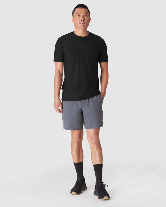 Model wearing Carbon 7 2-in-1 Training Shorts with pockets and comfort liner.