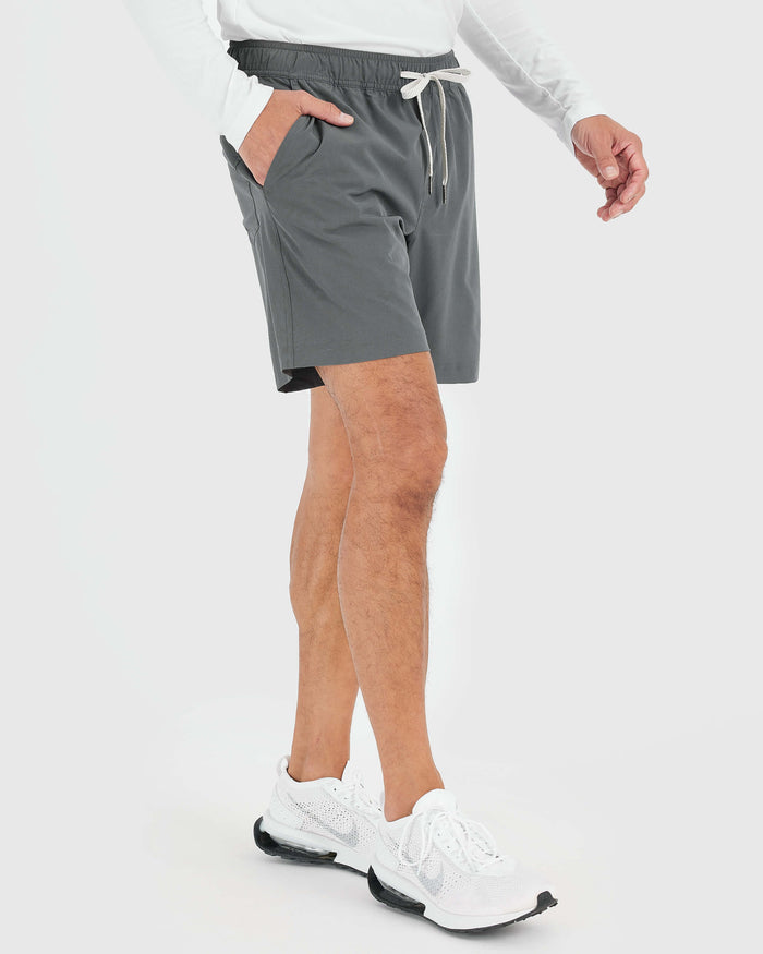 Man wearing Carbon Active Quick Dry Shorts with Liner, showcasing athletic fit.