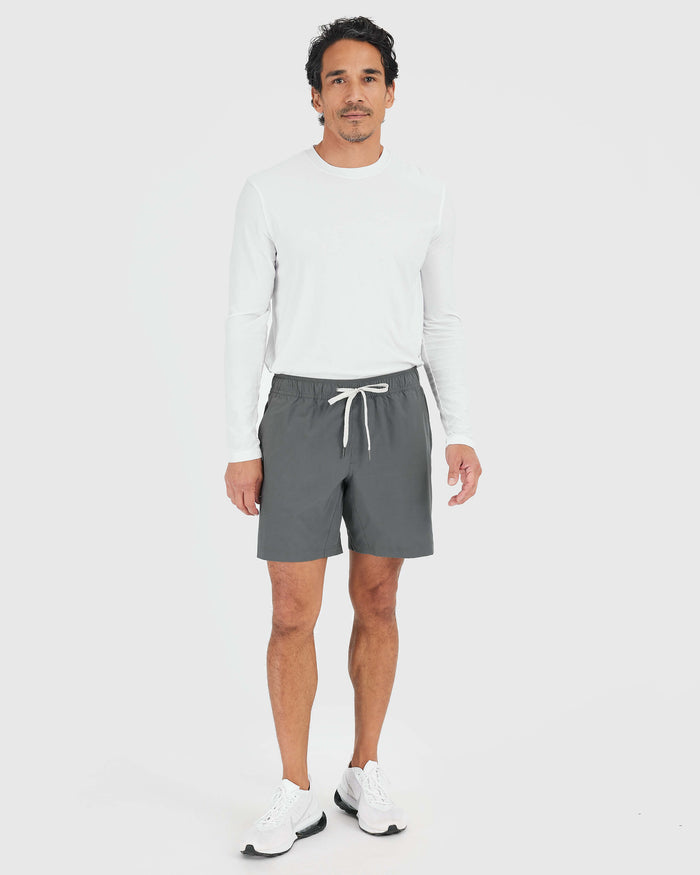 Man wearing Carbon Active Quick Dry Shorts with Liner, relaxed pose.