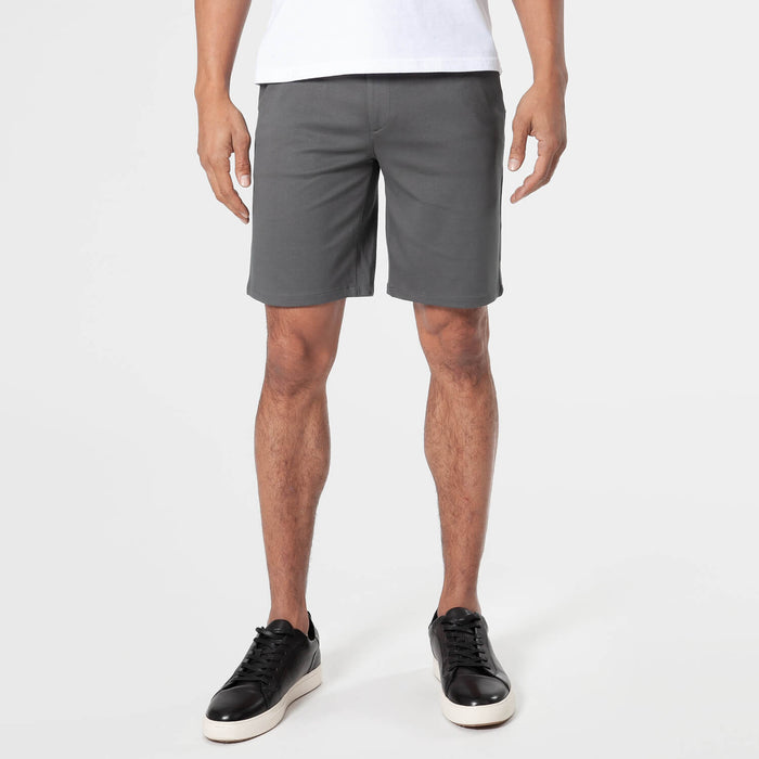 Carbon Comfort Chino Short worn with black sneakers.