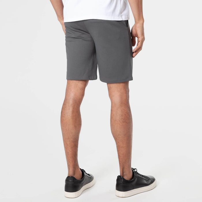 Carbon Comfort Chino Short showcased with black sneakers.