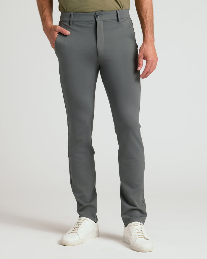 Carbon Slim Comfort Knit Chino Pant with white sneakers.