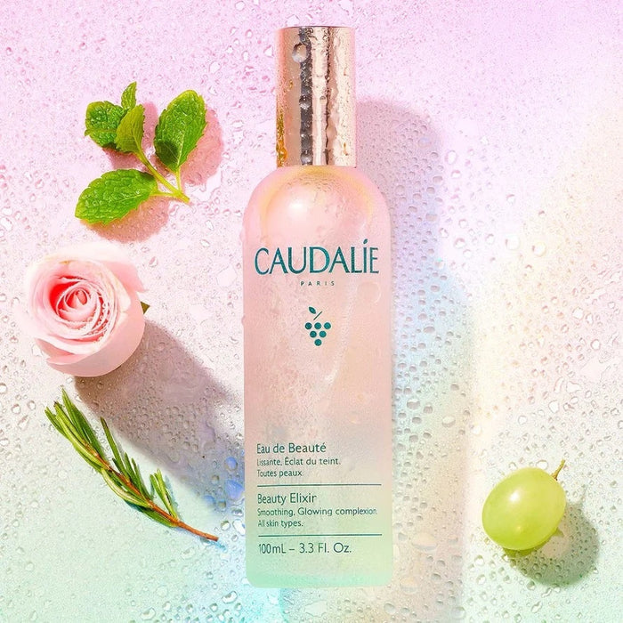 Caudalie Beauty Elixir 100ml skincare spray bottle, featuring a clear glass container with a sprayer for facial refreshment.