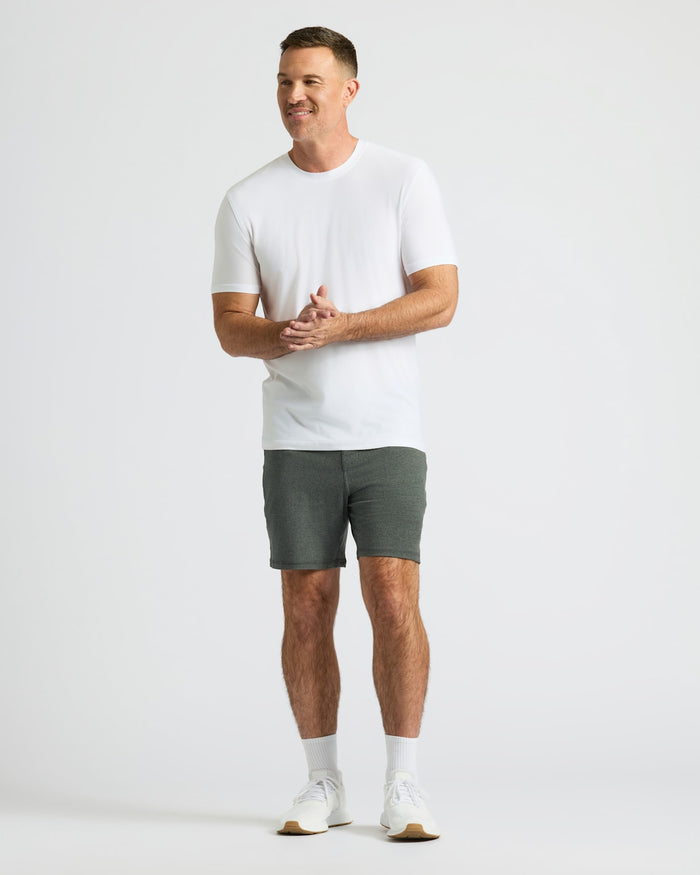 Man in Charcoal Heather Gray Active Comfort Shorts, white tee, and shoes.