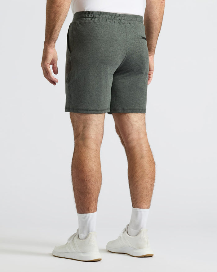 Man wearing Charcoal Heather Gray Active Comfort Shorts with white socks and sneakers.