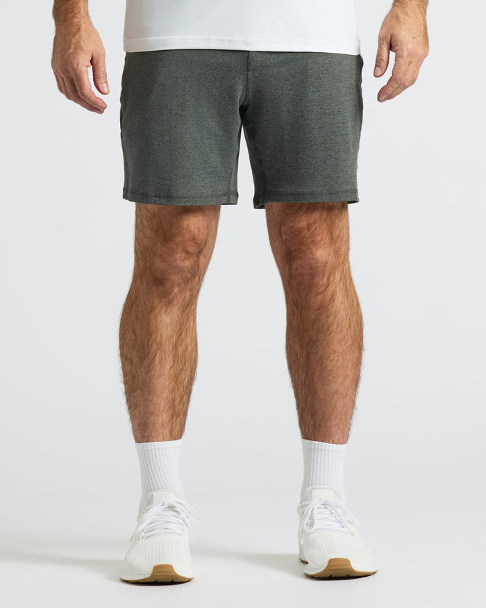 Man wearing Charcoal Heather Gray Active Comfort Shorts, white socks, and sneakers.
