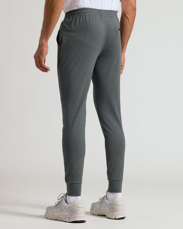 Charcoal Heather Gray Active Joggers with elastic cuffs and white sneakers.