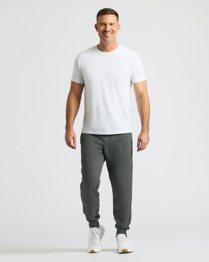 Man wearing Charcoal Heather Gray Fleece French Terry Joggers.