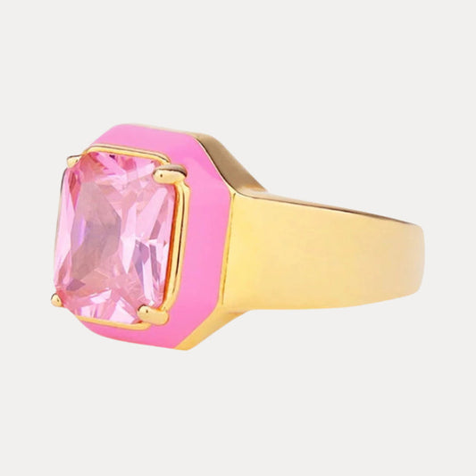 a pink and gold ring with a large pink stone