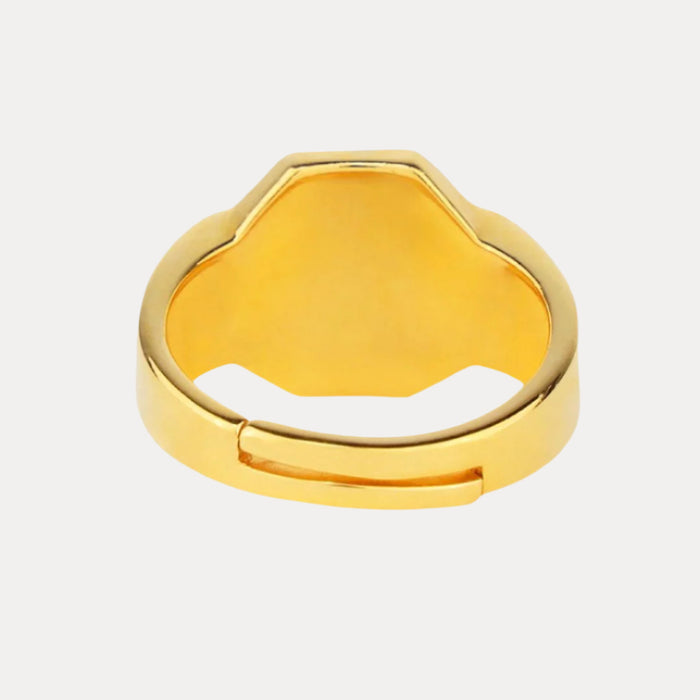 a gold ring with a cut out center