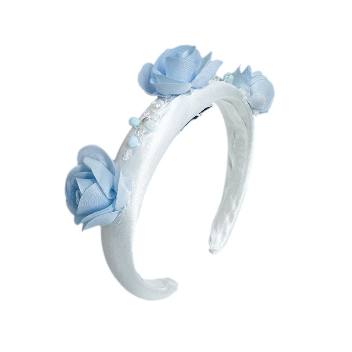 Daphne white satin headband with blue embroidered flowers, faux pearl and rhinestone beading, and soft satin lining for girls.