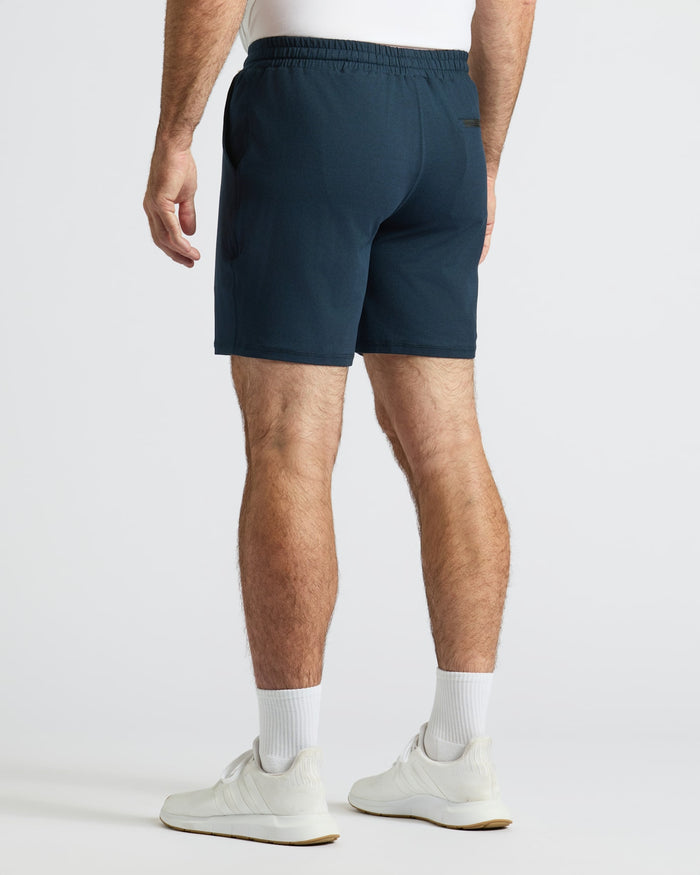 Dark Heather Navy Active Comfort Shorts worn with white socks and sneakers.
