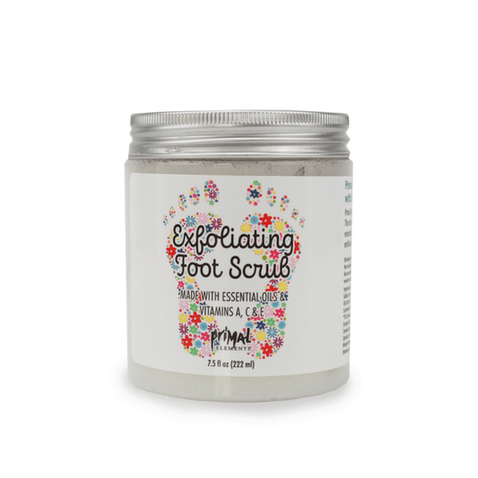 Jar of Exfoliating Foot Scrub | Primal Elements with a floral footprint design on the label, promoting skincare with essential oils and vitamins A, C, and E.
