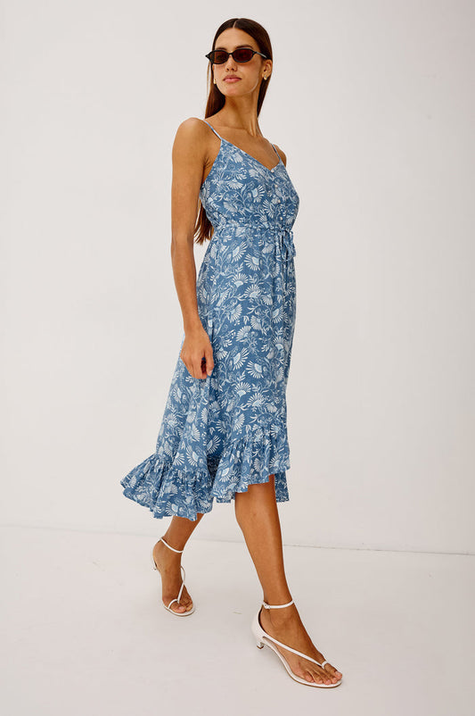 Frida Midi Dress in Luxe Linen With Center-Front Buttons, Adjustable Waist Ties, Adjustable Spaghetti Straps, High-Low Hem, and Full Cotton Lining in Blue Cassia Colorway - Full Body Front View Featured on Model