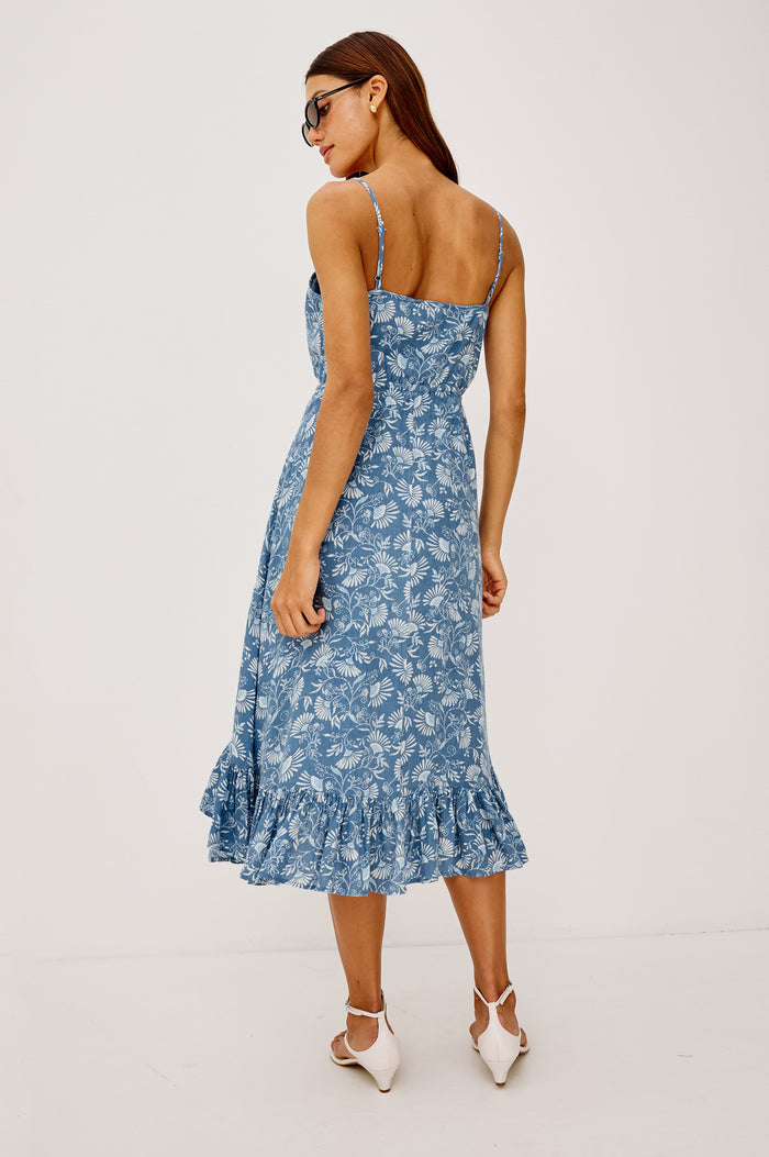 Frida Midi Dress in Luxe Linen With Center-Front Buttons, Adjustable Waist Ties, Adjustable Spaghetti Straps, High-Low Hem, and Full Cotton Lining in Blue Cassia Colorway - Full Body Back View Featured on Model
