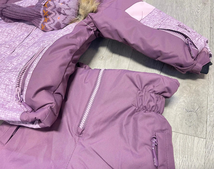 Close-up of Blizz girls Lavender winter jacket showing zipper, snow skirt, and insulated construction.