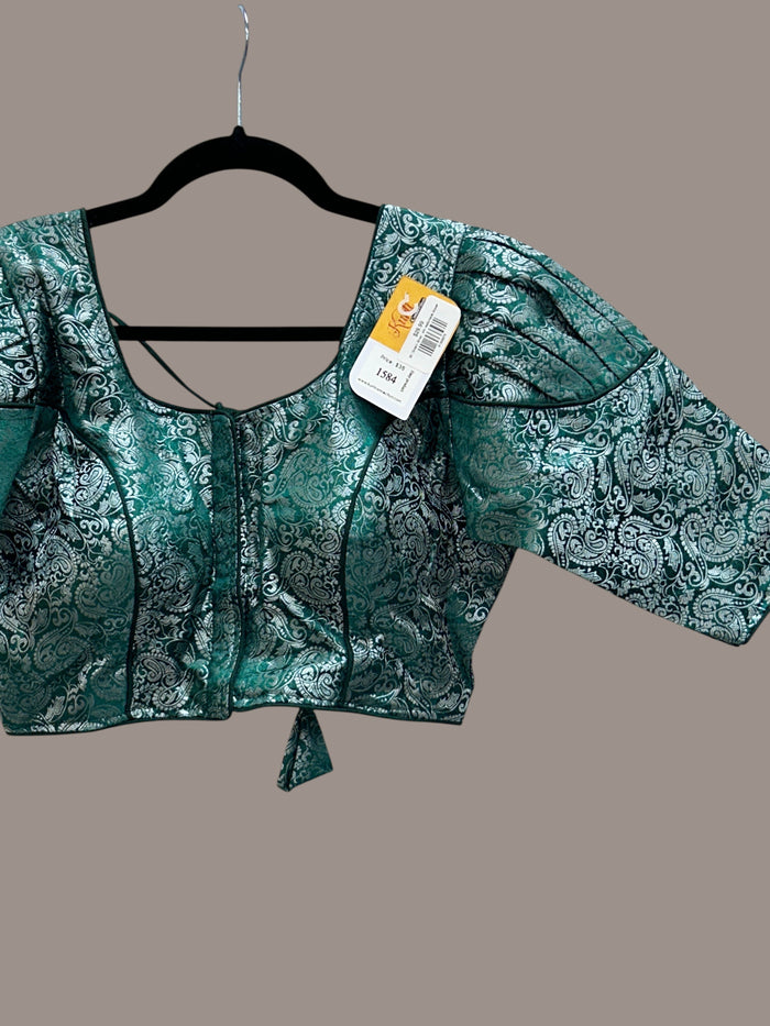 Kurti Connection USA emerald green and silver brocade blouse with a square neckline and puff sleeves.